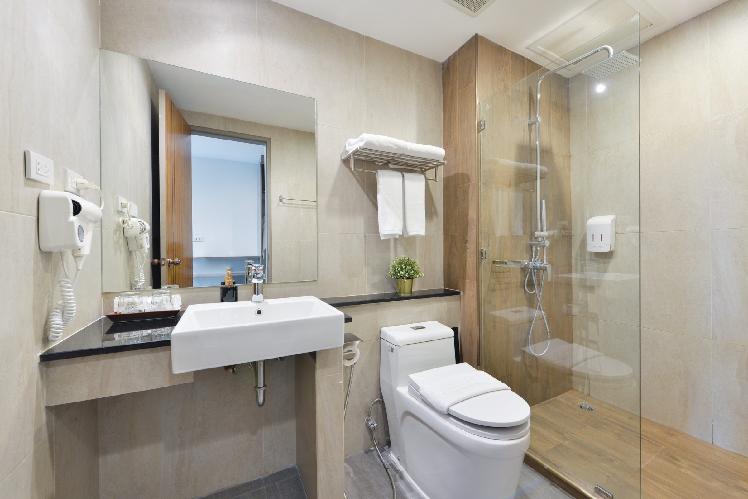 The ensuite rain shower in a Deluxe King room at StayAt Bedever