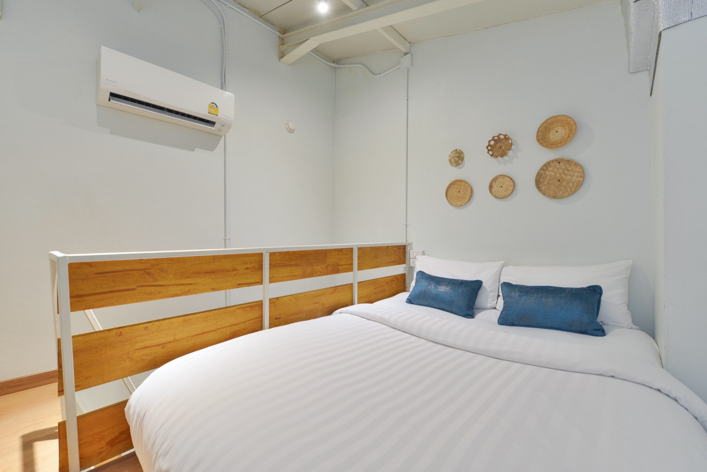 The upper sleeping deck of a Loft Studio at StayAt Bedever, with a queen bed