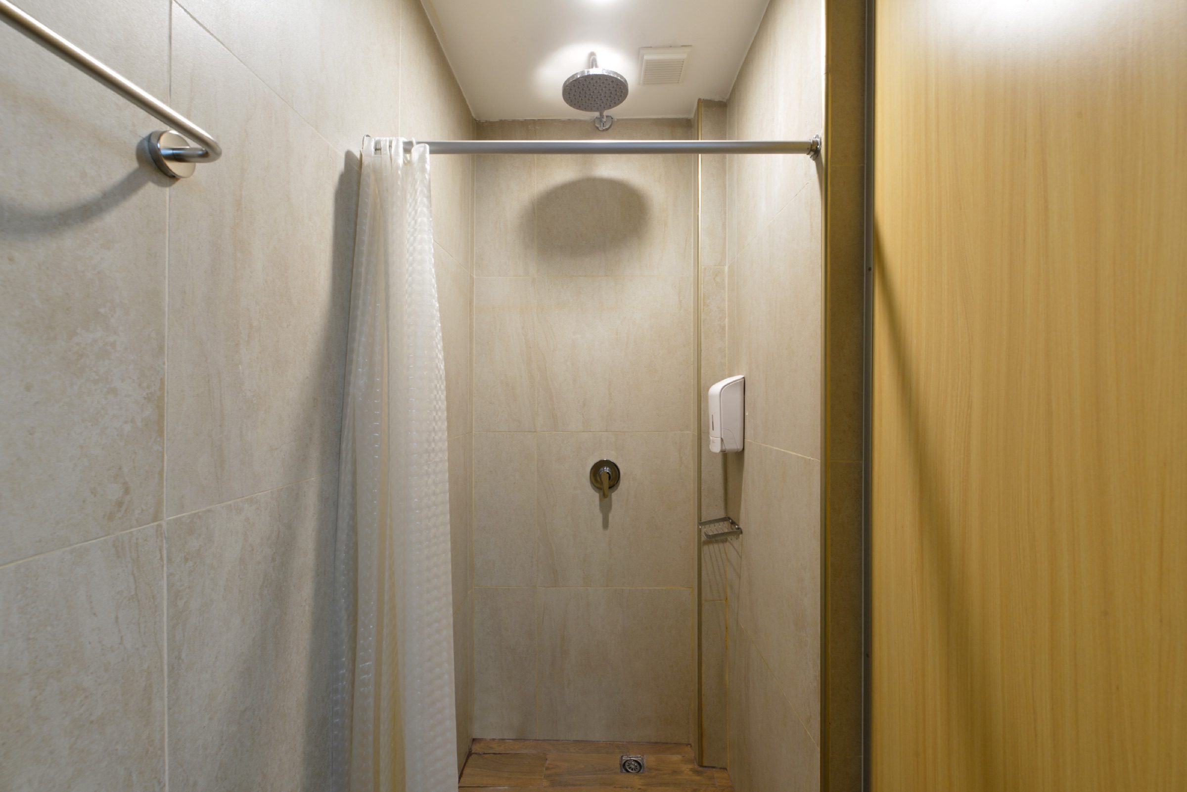 A private rain-shower stall in the shared bathroom on the Loft floor at StayAt Bedever