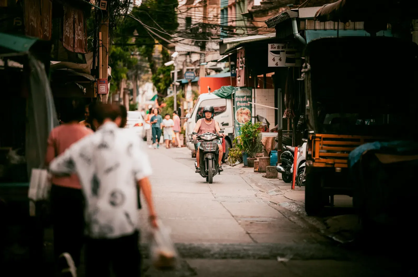 A vibrant street scene in Bangkok highlighting everyday life and local culture.