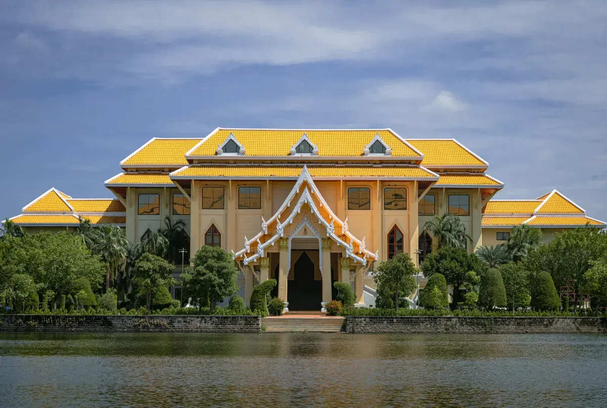 Stunning Thai architecture with yellow roof by water in Ayutthaya, Thailand.